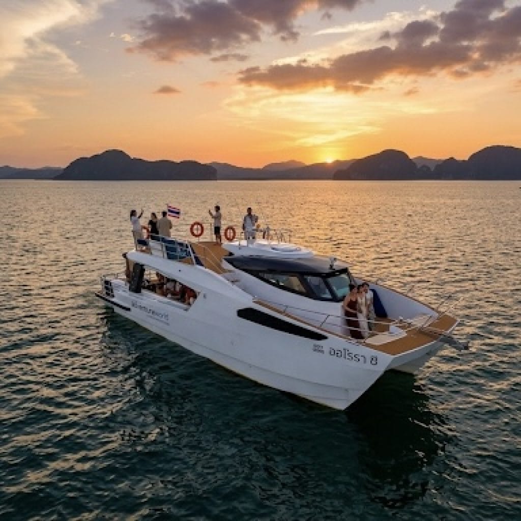 Phang Nga Bay tour at sunset — Aurora Sea catamaran past limestone karsts