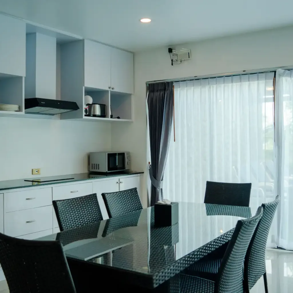 Open-plan kitchen and dining area with garden doors